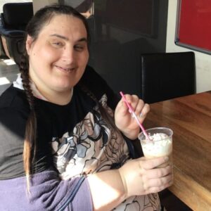 female resident enjoying milkshake