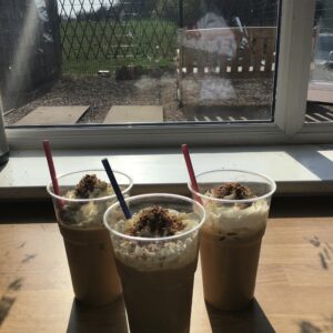 milkshakes and ice coffee on windowsill