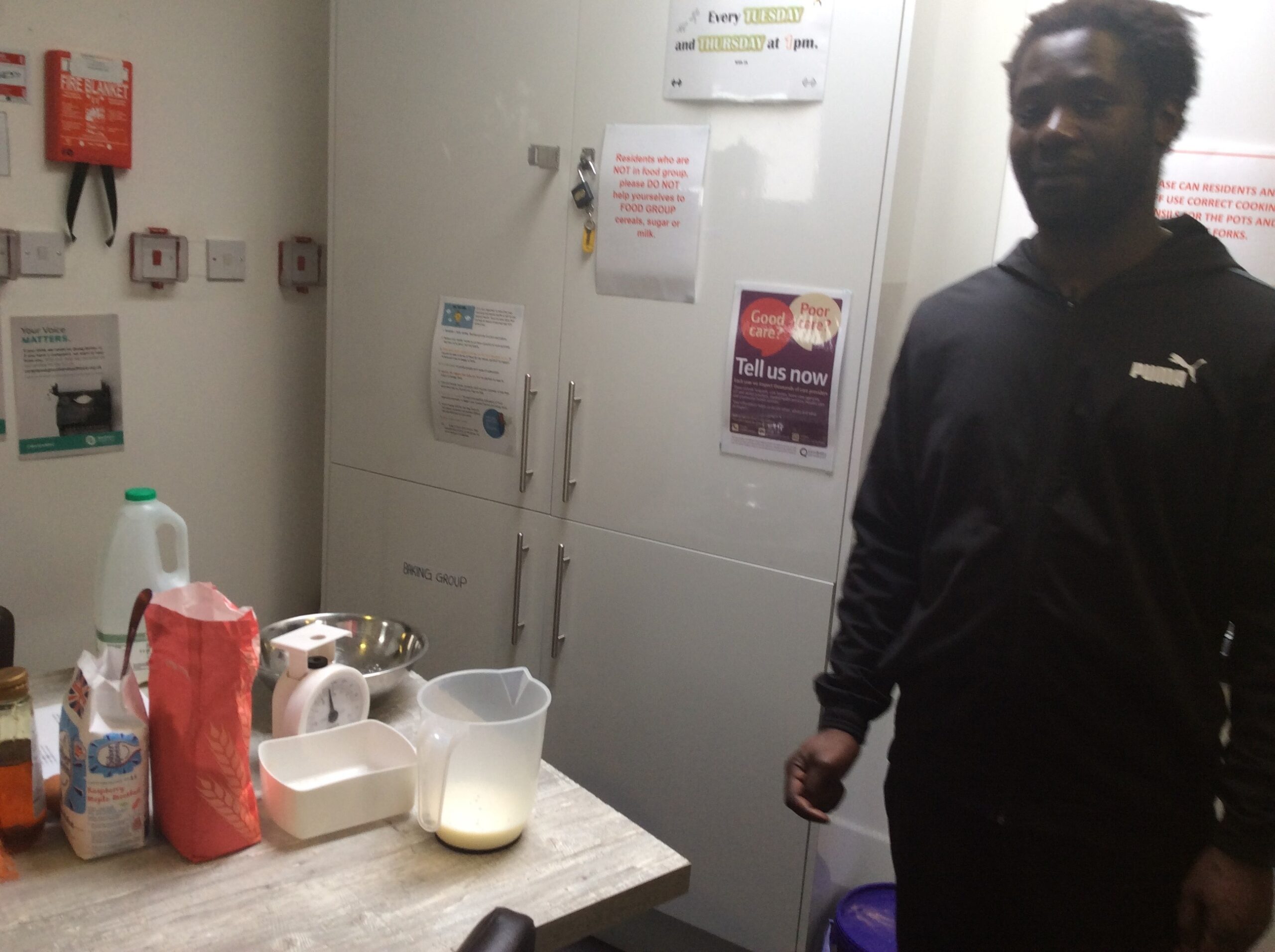 male resident making pancakes