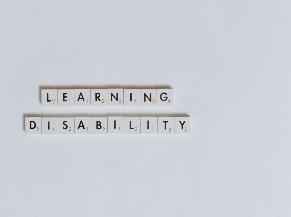 white letter tiles spelling "learning disability"