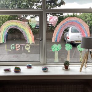 Pride window displays: rainbow and trees