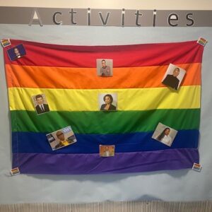 rainbow flag decorated with famous faces