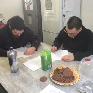 Two male residents taking part in a quiz