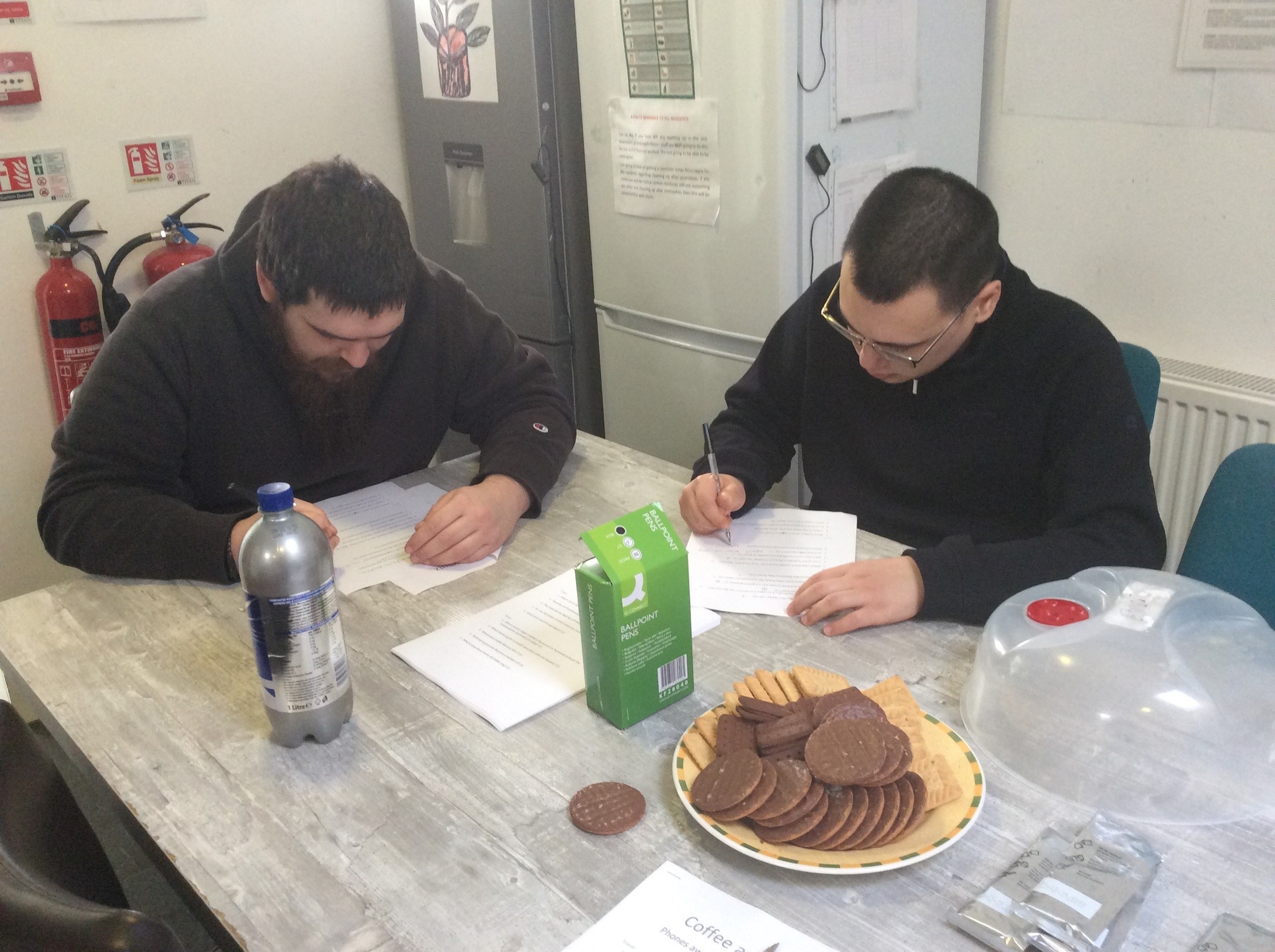 Two male residents taking part in a quiz