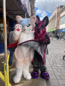 resident in homemade rabbit costume posing with another person in rabbit costume