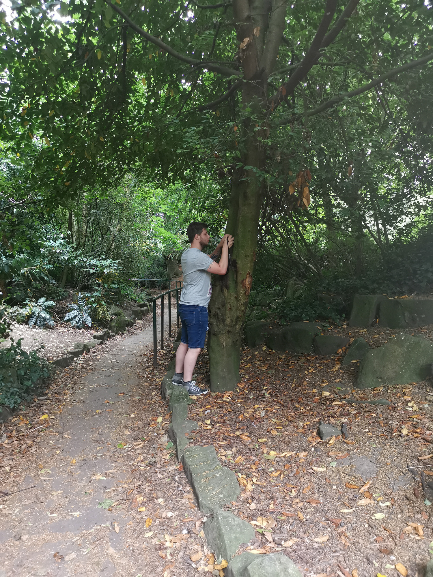 resident taking photo in woods