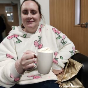 Female resident holding hot chocolate