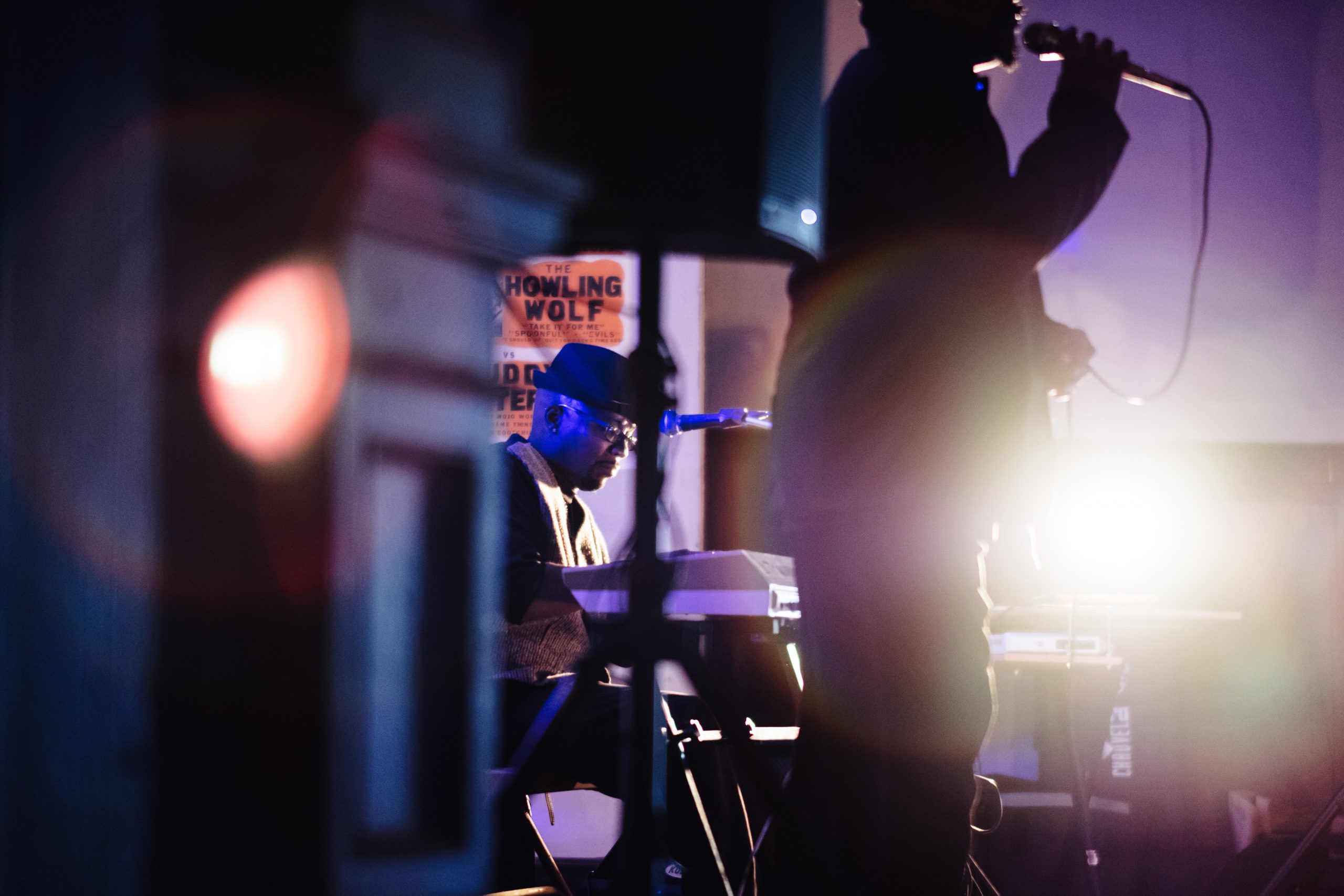 silhouette of man singing on stage