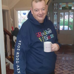 Resident wearing Robbie Williams merchandise