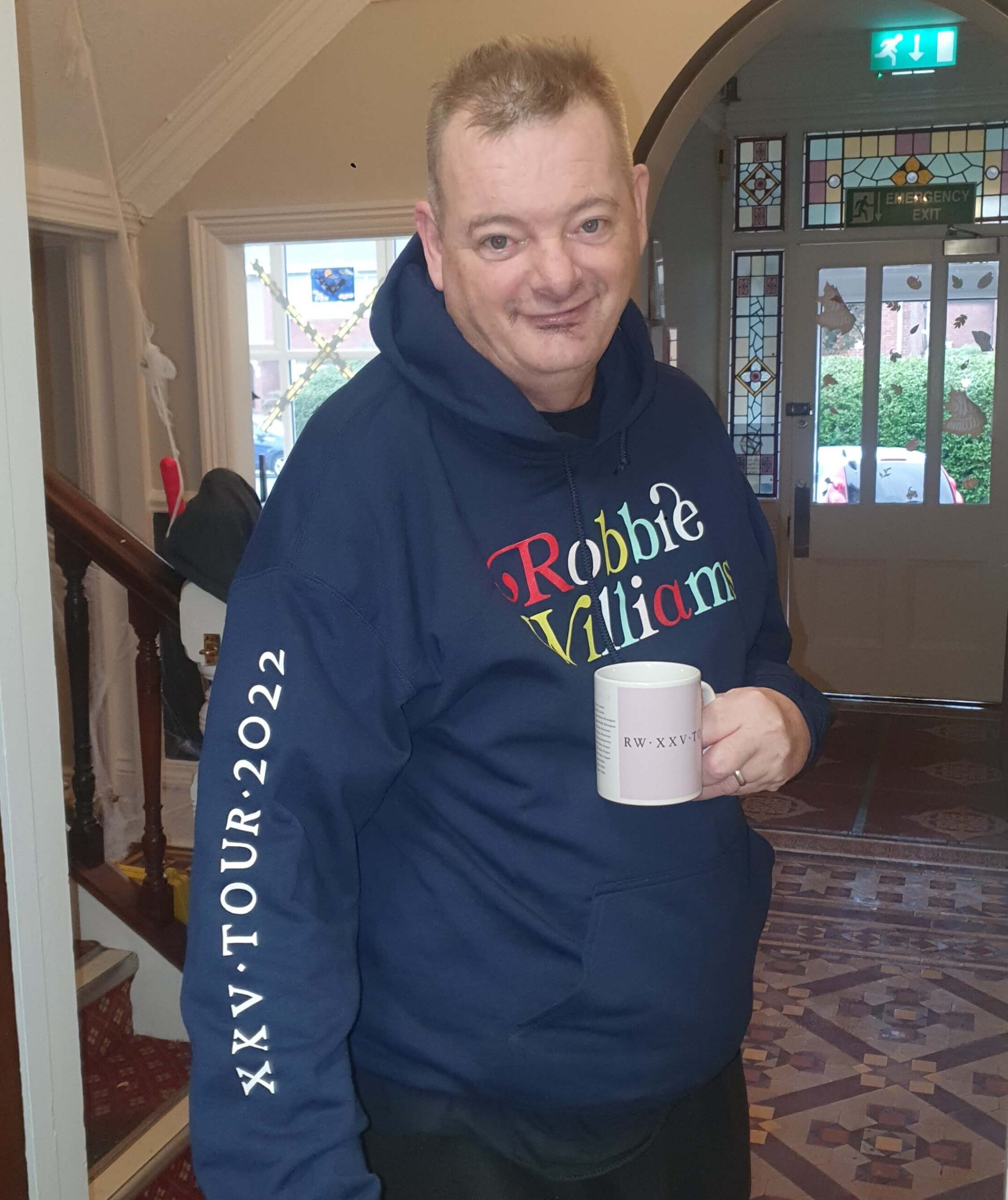 Resident wearing Robbie Williams merchandise