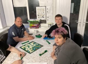 residents playing game of scrabble