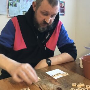 resident making Scrabble picture frame