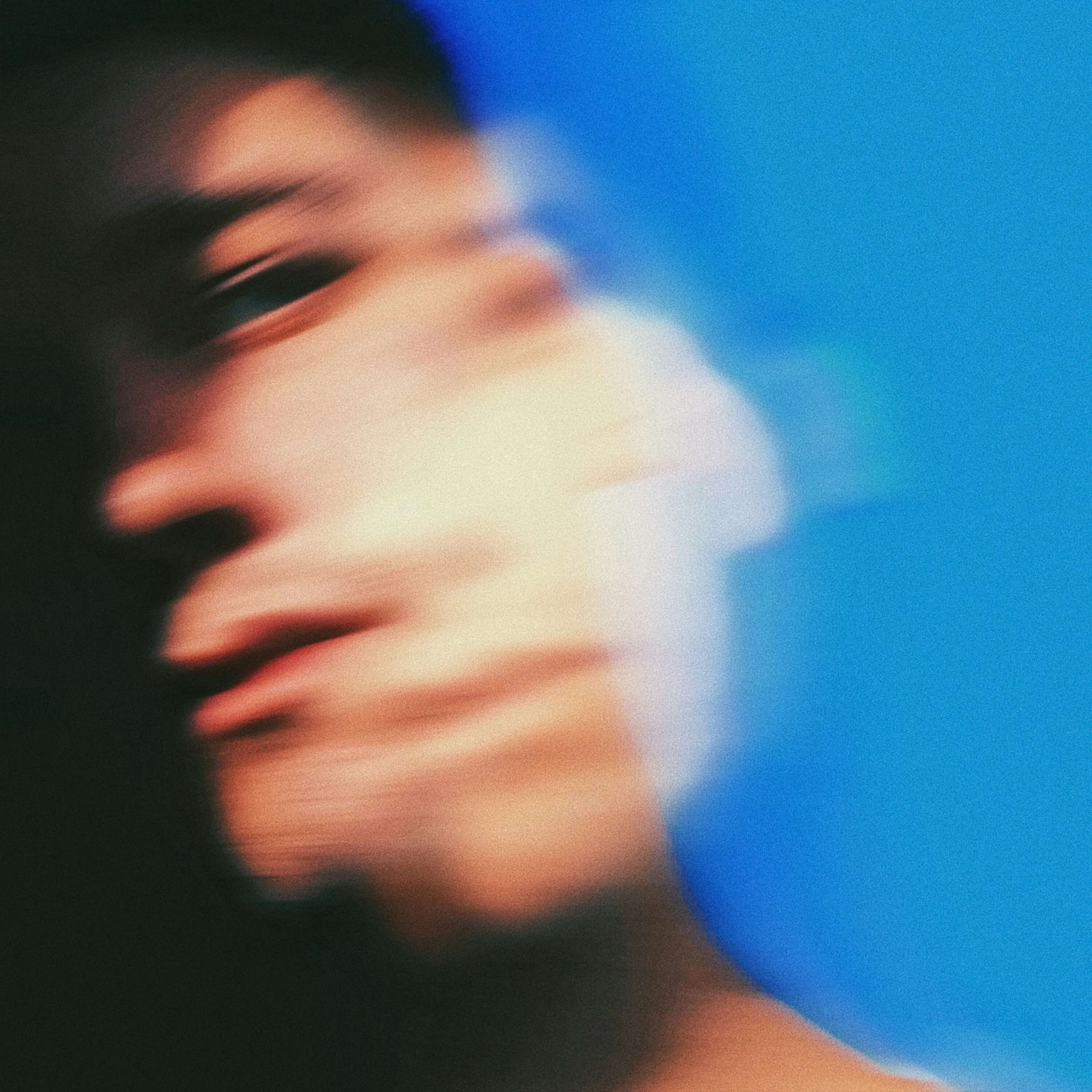 A blurred face representing schizophrenia for a blog on what schizophrenia is.