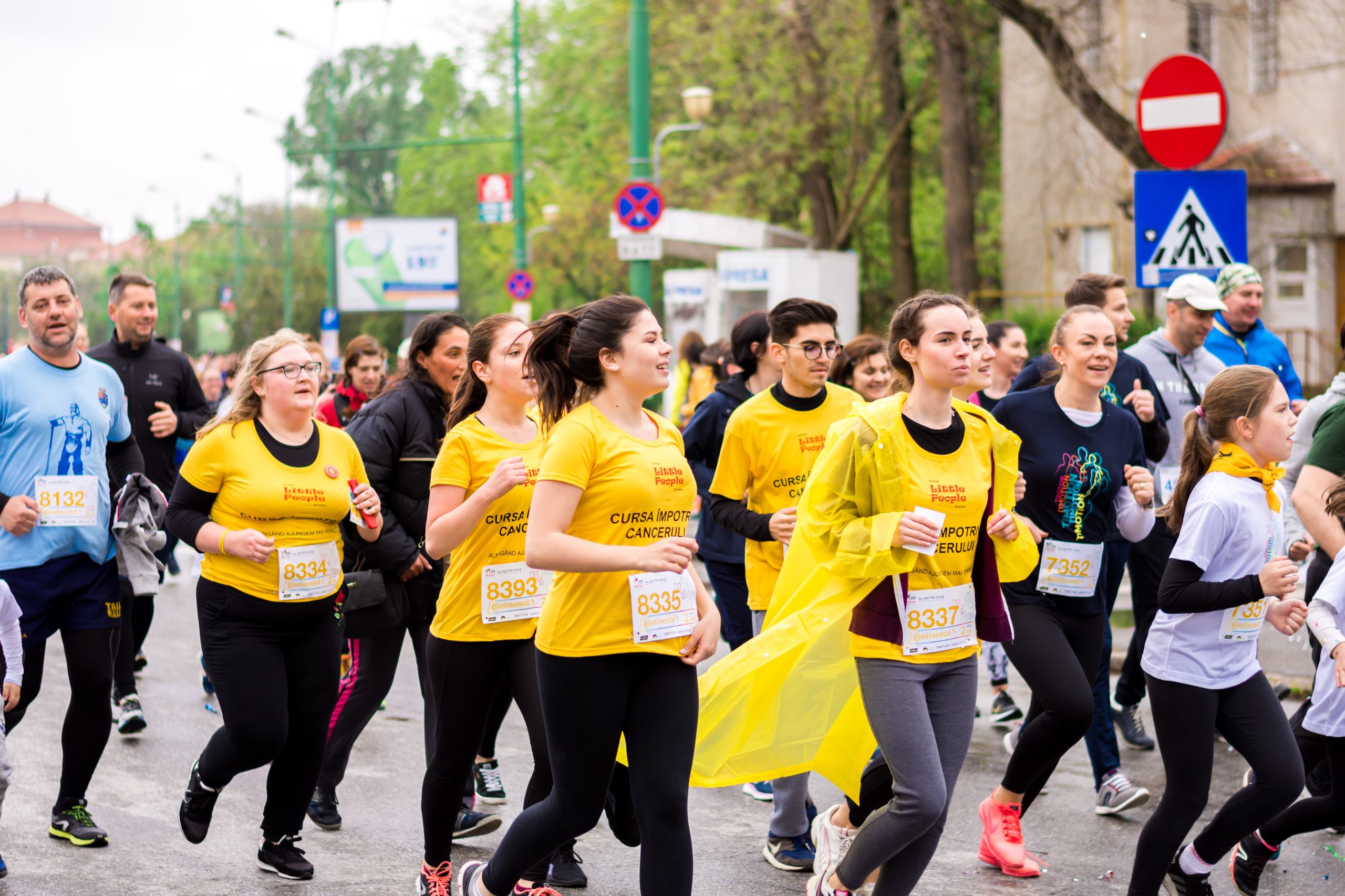 charity fundraising runners in yellow tops