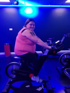 female resident at gym on spin bike