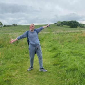 male in grassy field