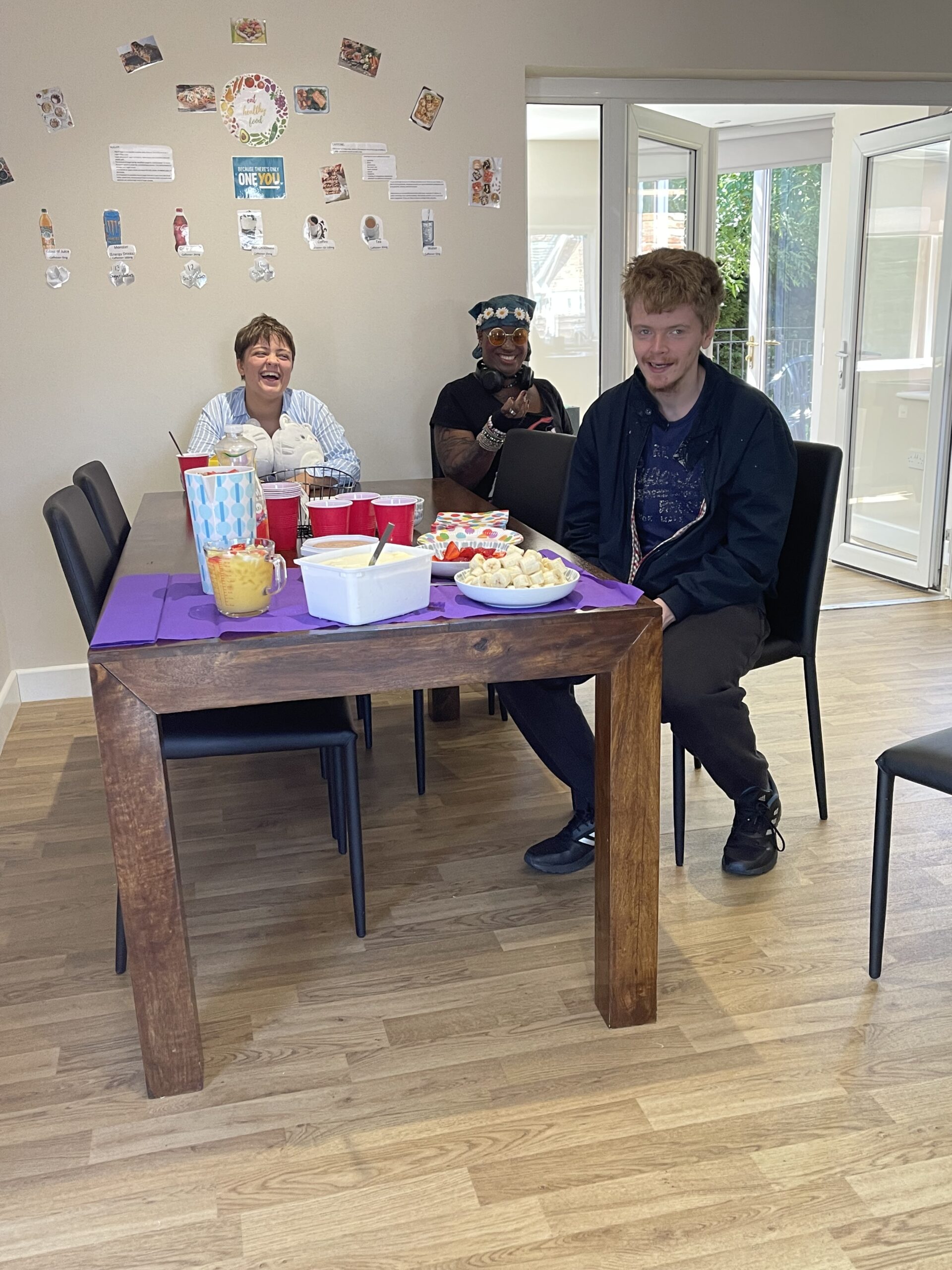 3 residents enjoying strawberries and cream