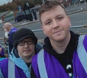 Resident and team member at street kitchen