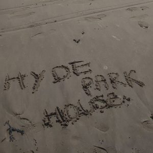 Hyde Park House written in the sand
