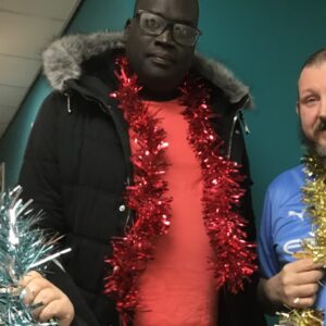 residents with tinsel scarves