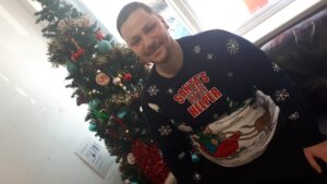 resident wearing christmas jumper