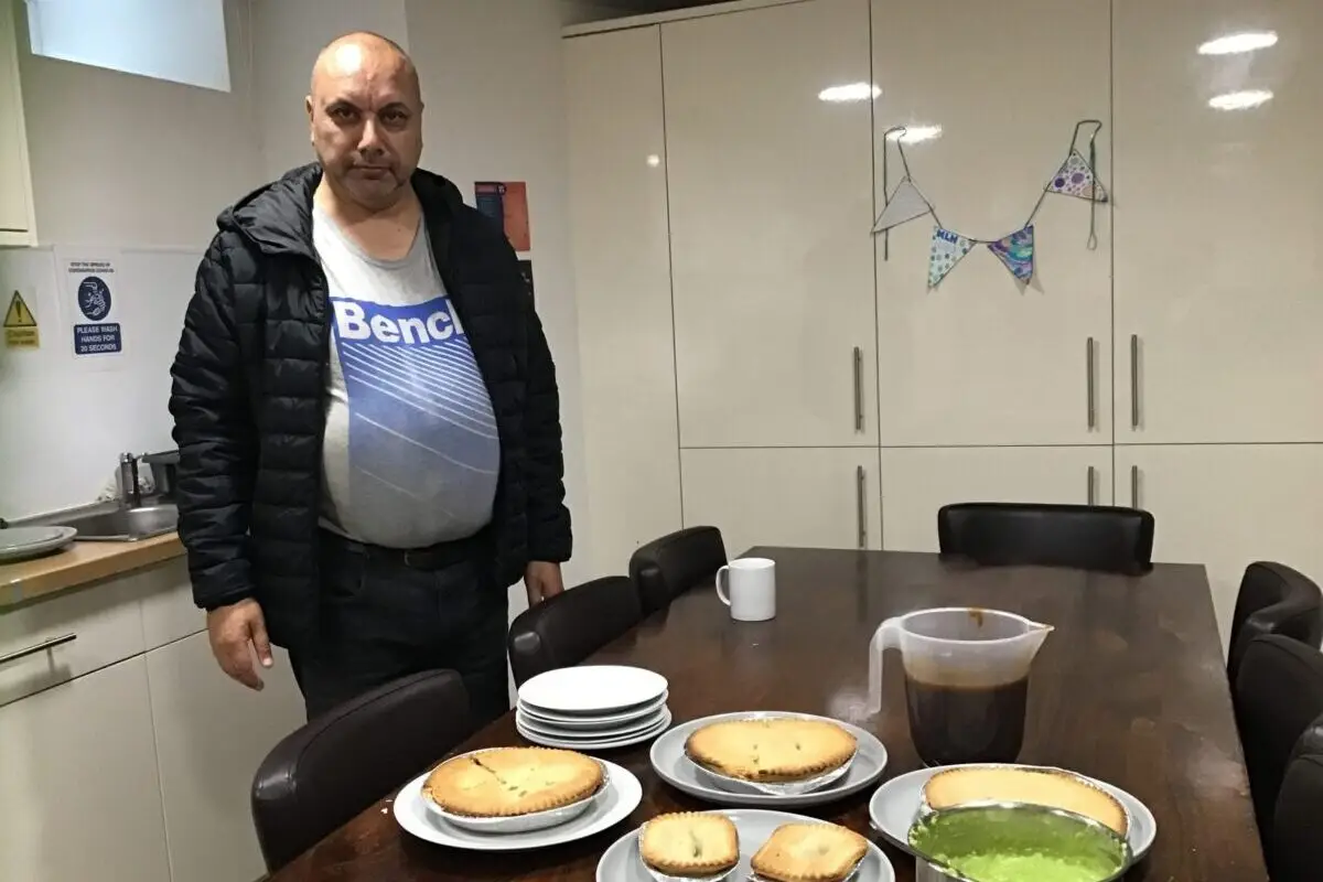 resident with pie and peas