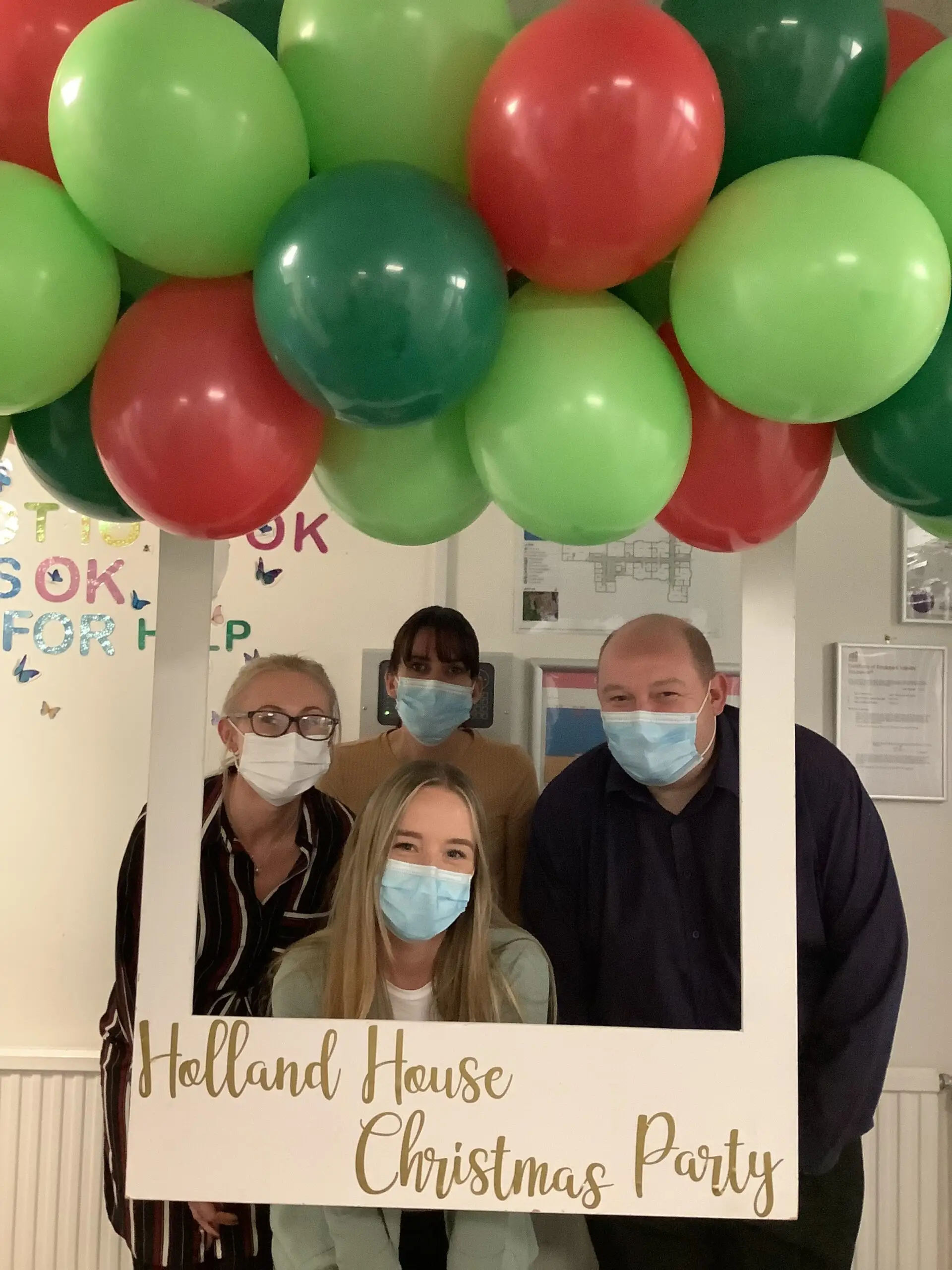 staff posing in christmas photo booth