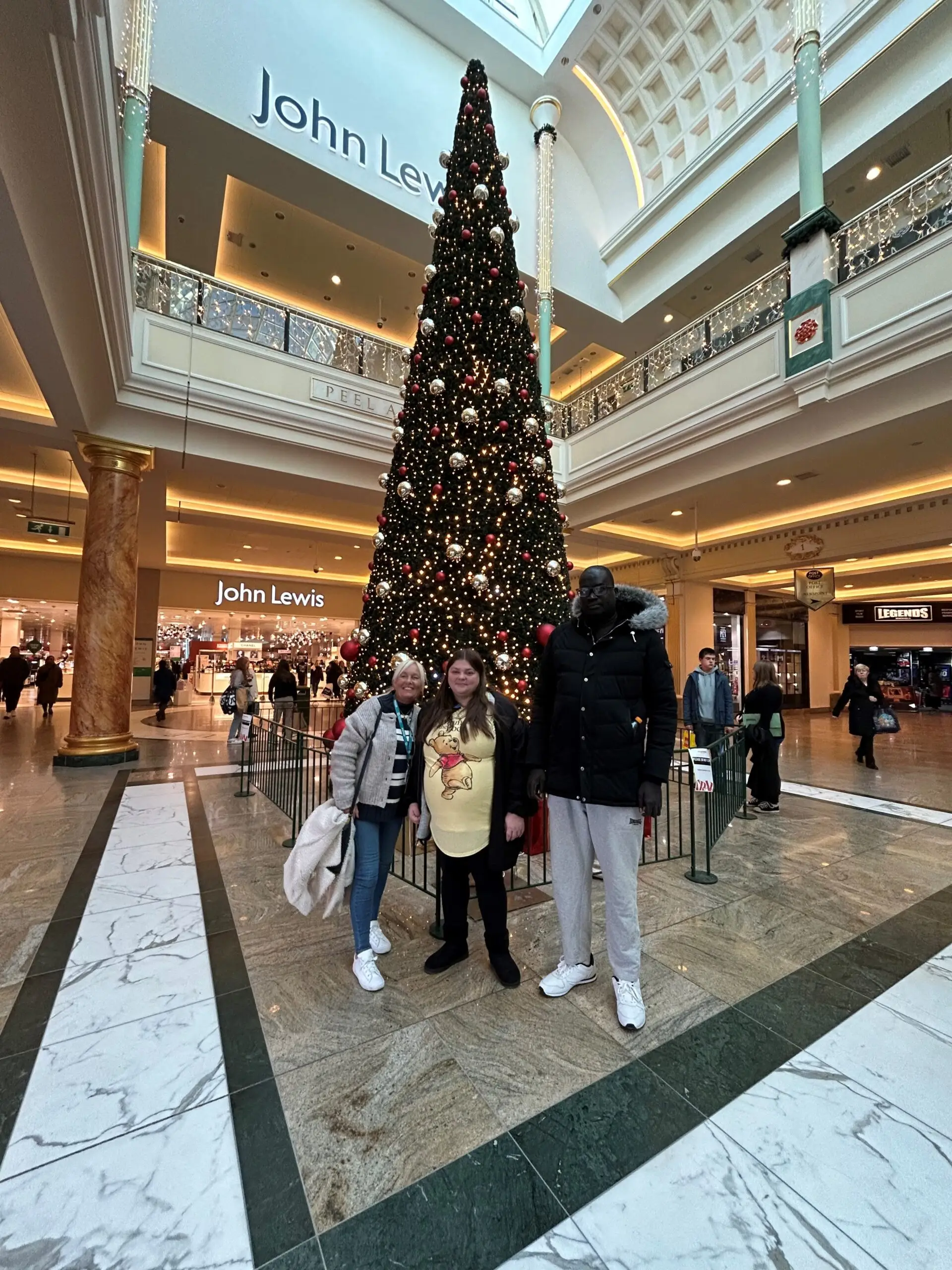 residents in front of giant Christmas tree