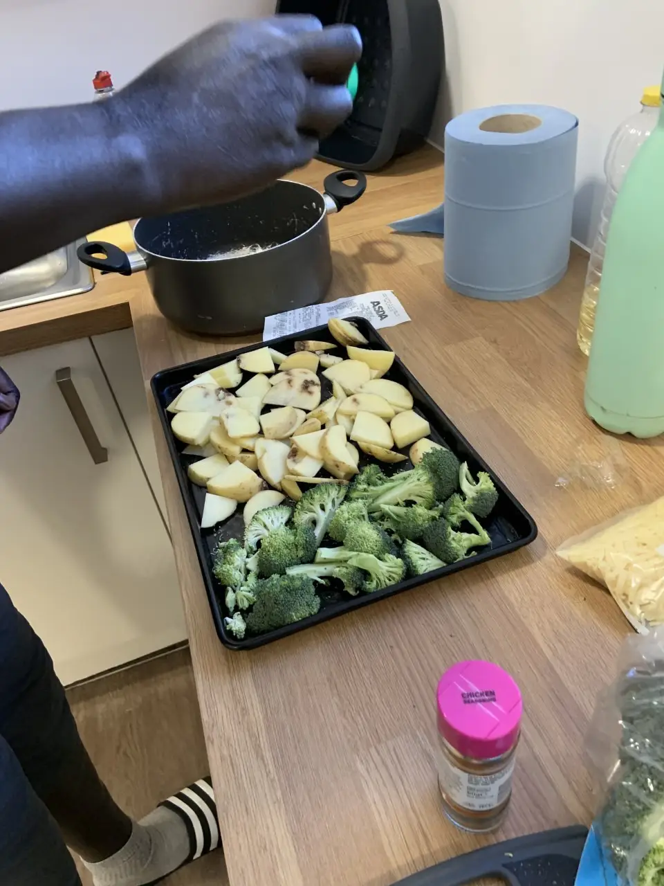 tray of chopped potatoes and broccoli
