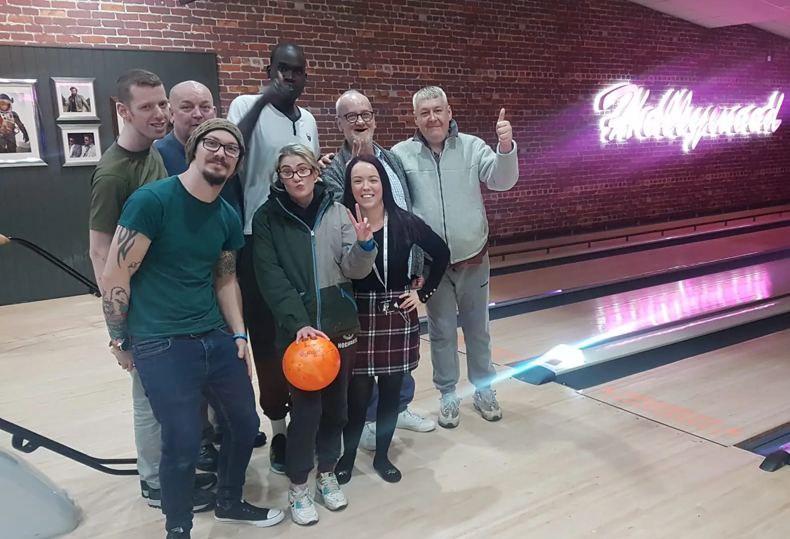 female holding bowling ball
