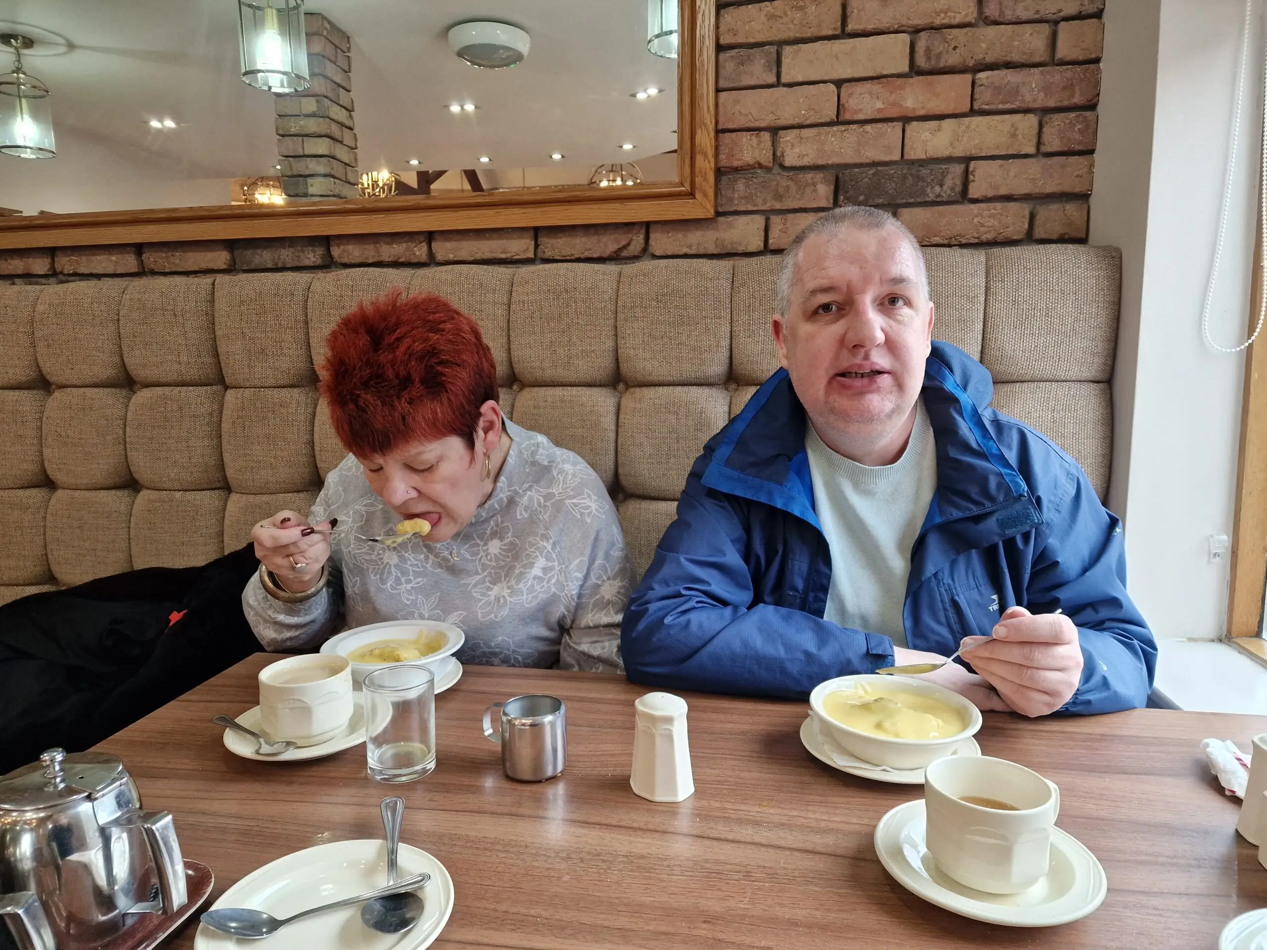 female and male resident enjoying fish and chips