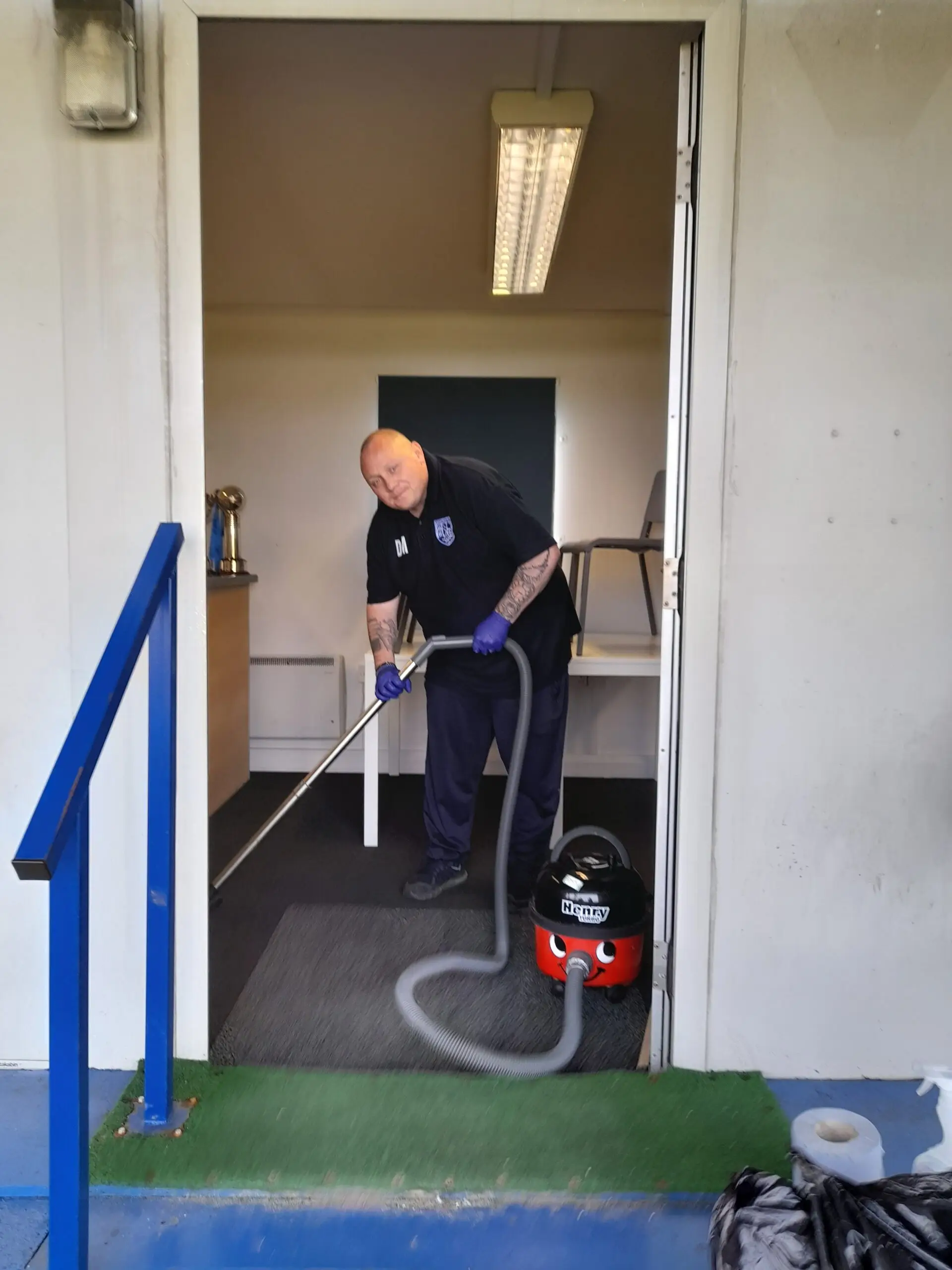 male hoovering carpet