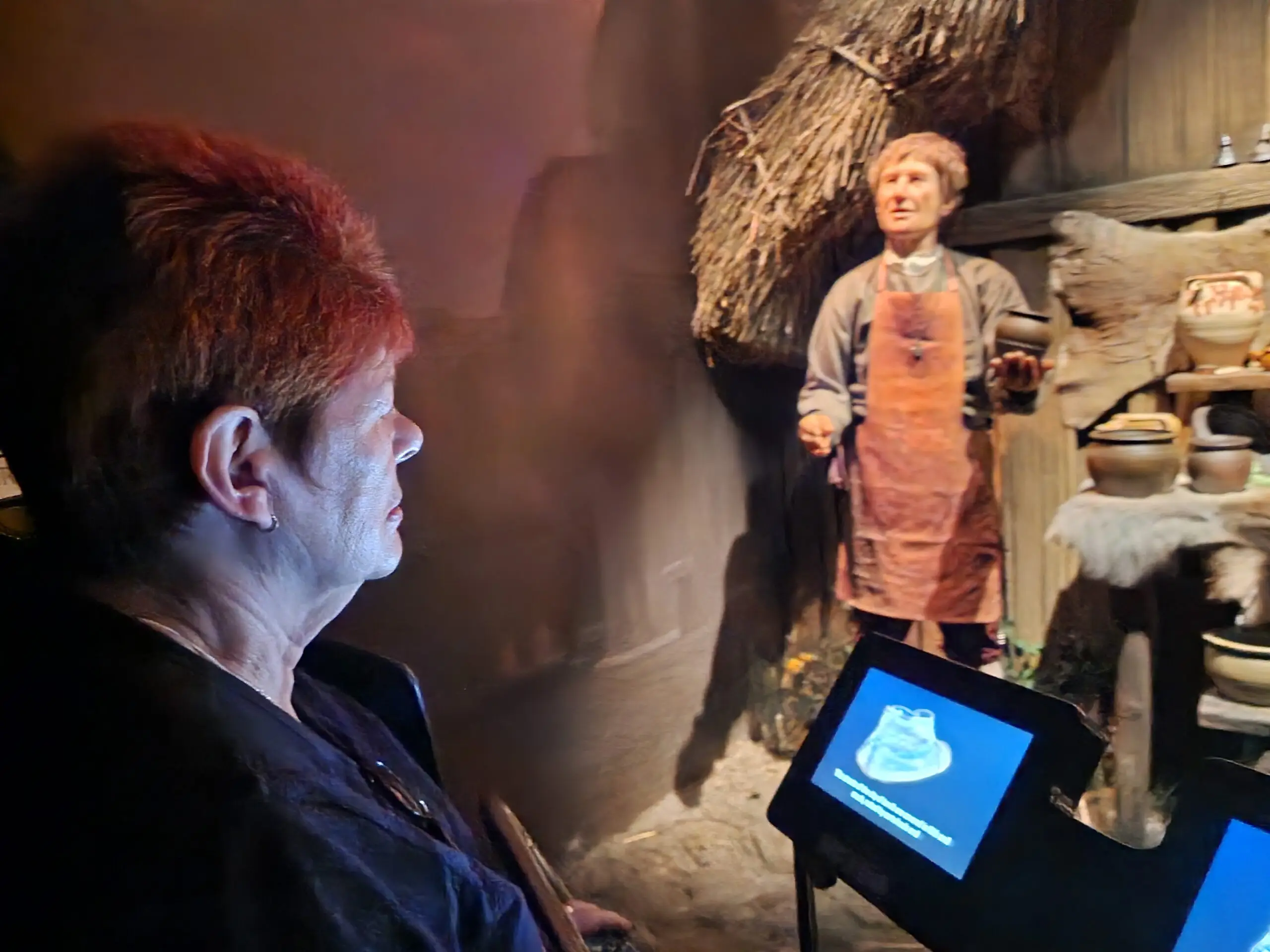 resident looking at museum display