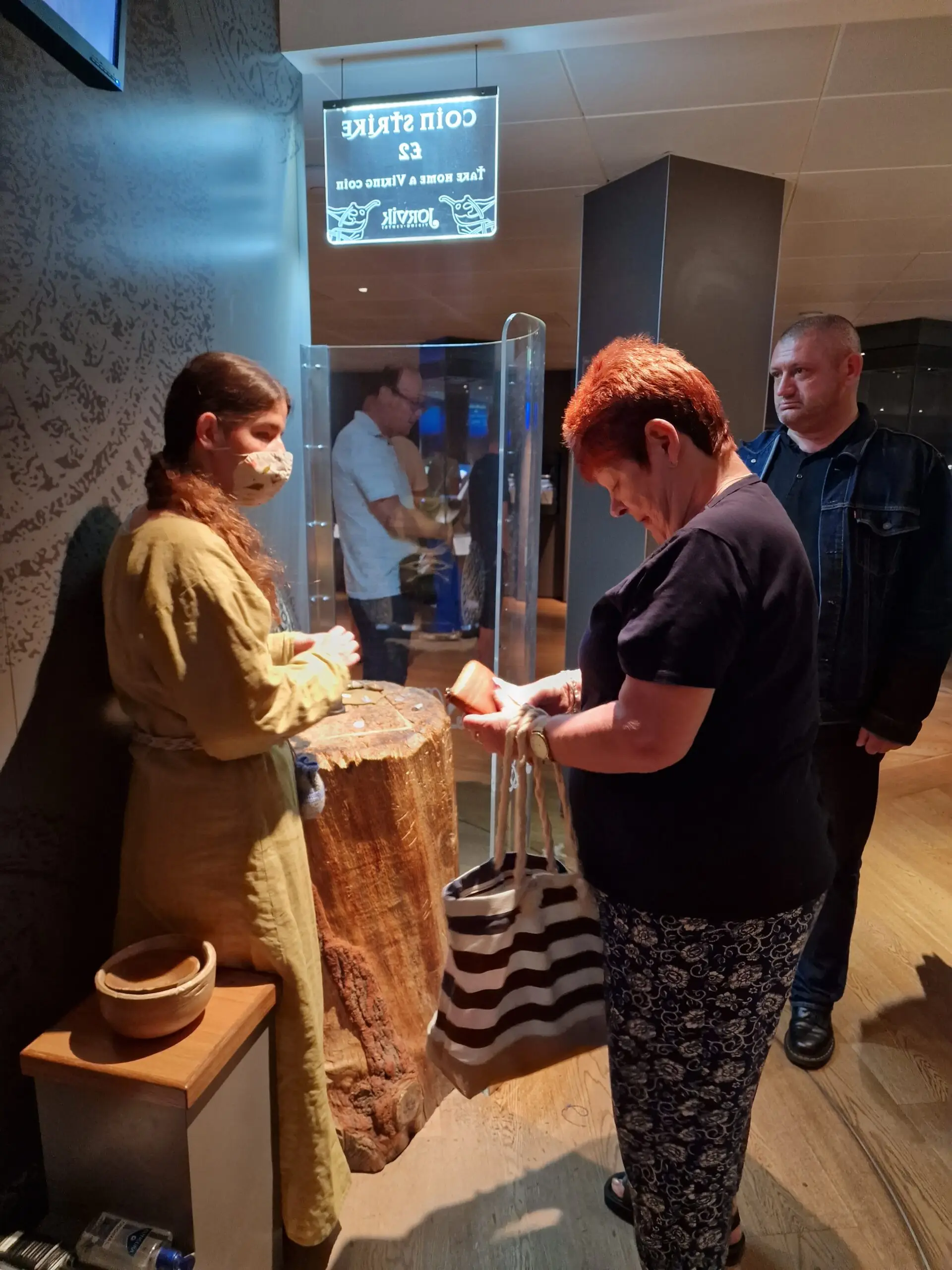 resident looking at museum artifacts