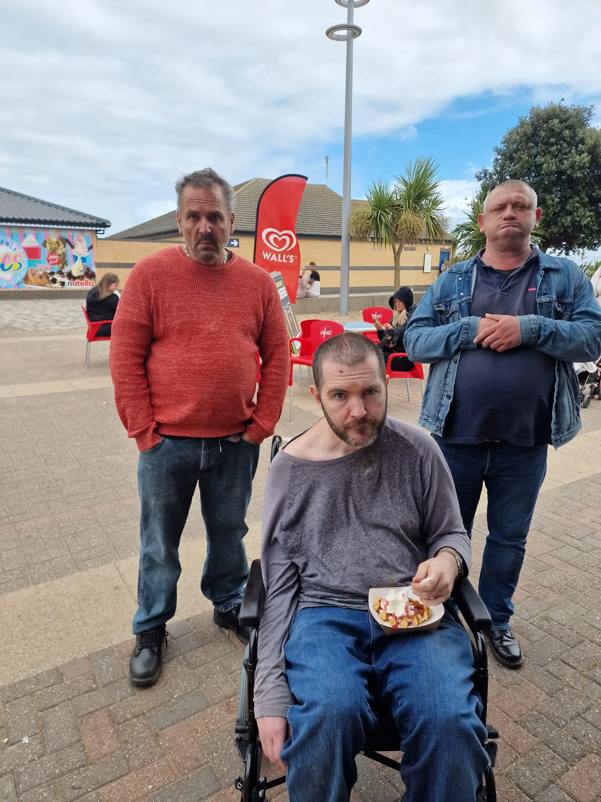 3 male residents on seafront