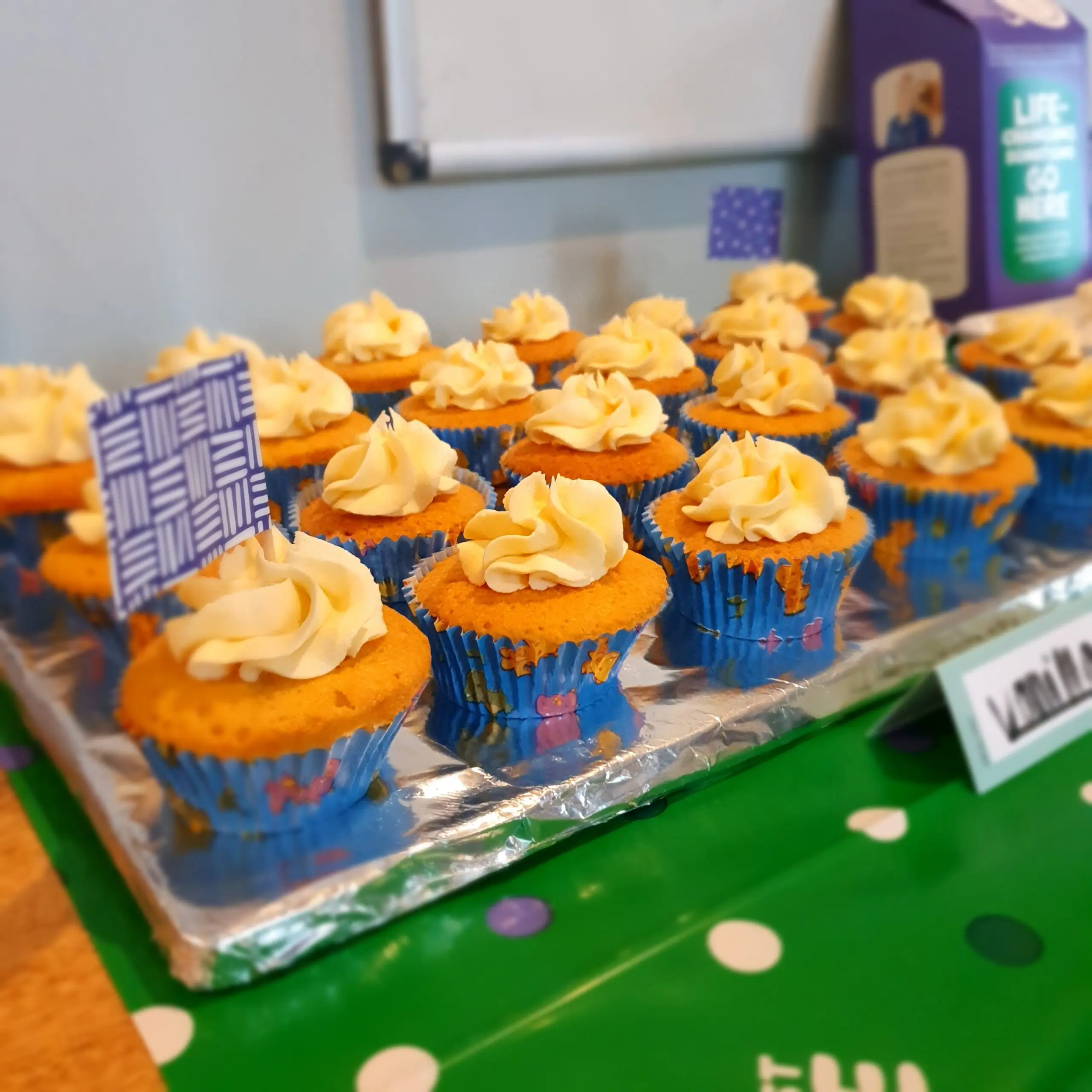 plate of vanilla cupcakes