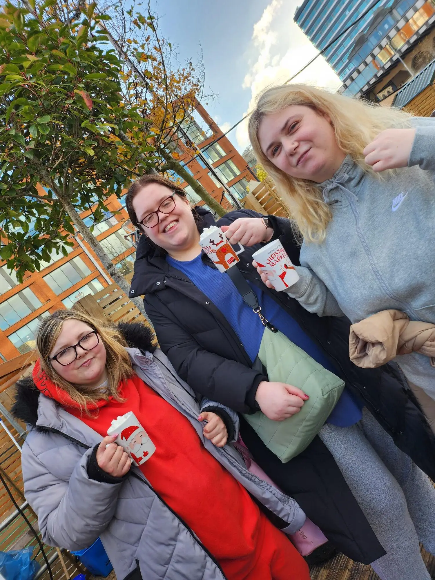 residents at Christmas markets enjoying hot chocolates