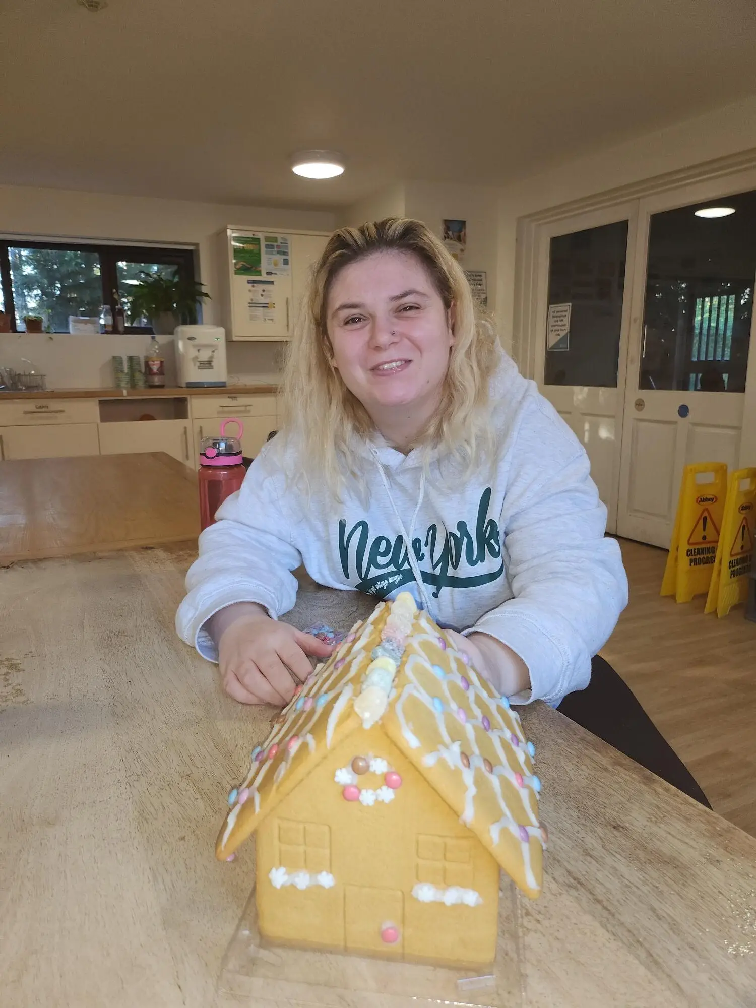 resident decorating gingerbread house