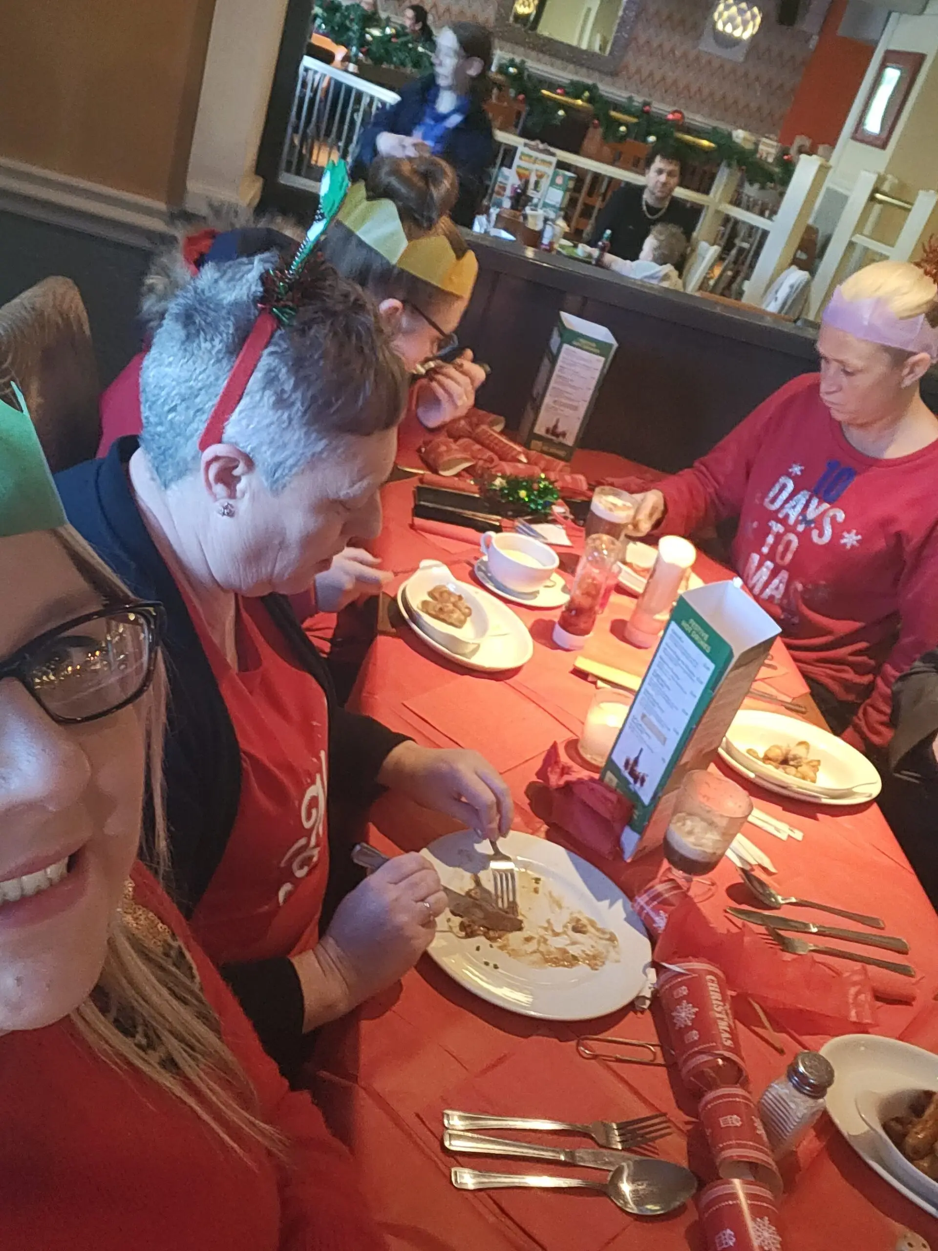 team member and residents enjoying Christmas lunch