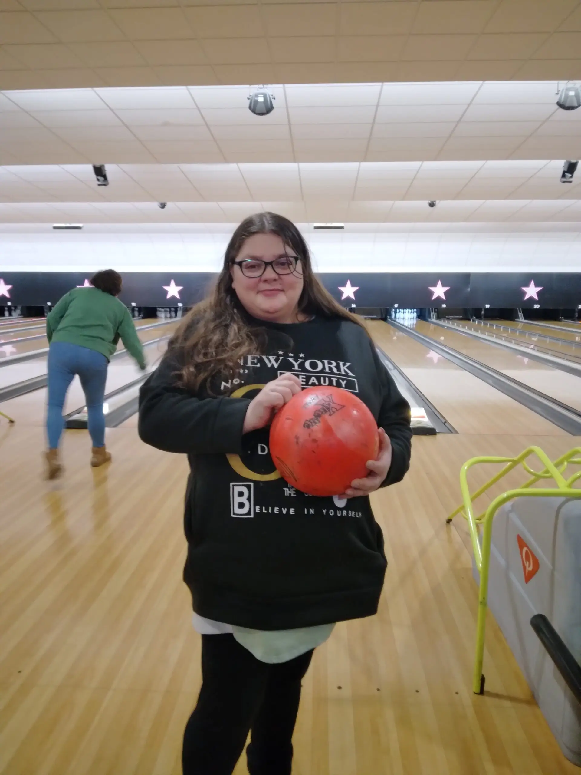 resident holding bowling ball