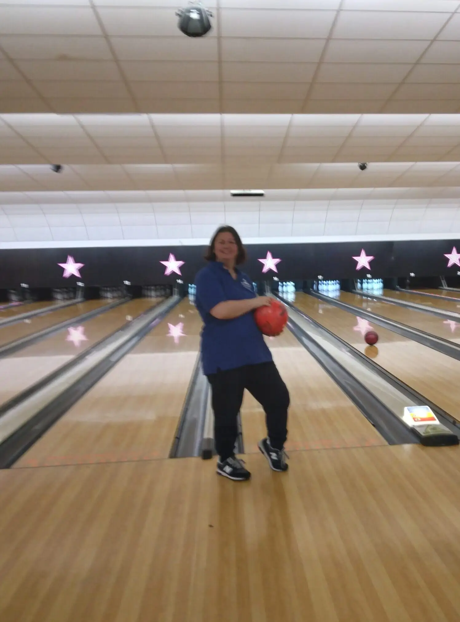 resident holding bowling ball