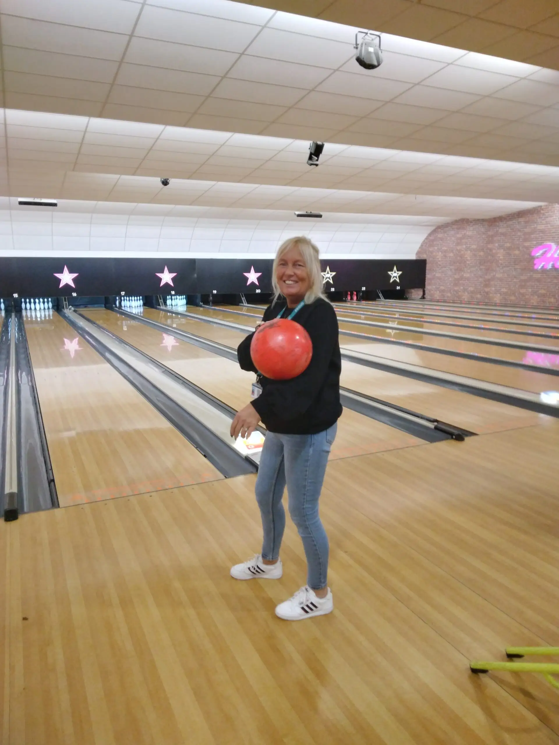 OT Support Worker holding bowling ball