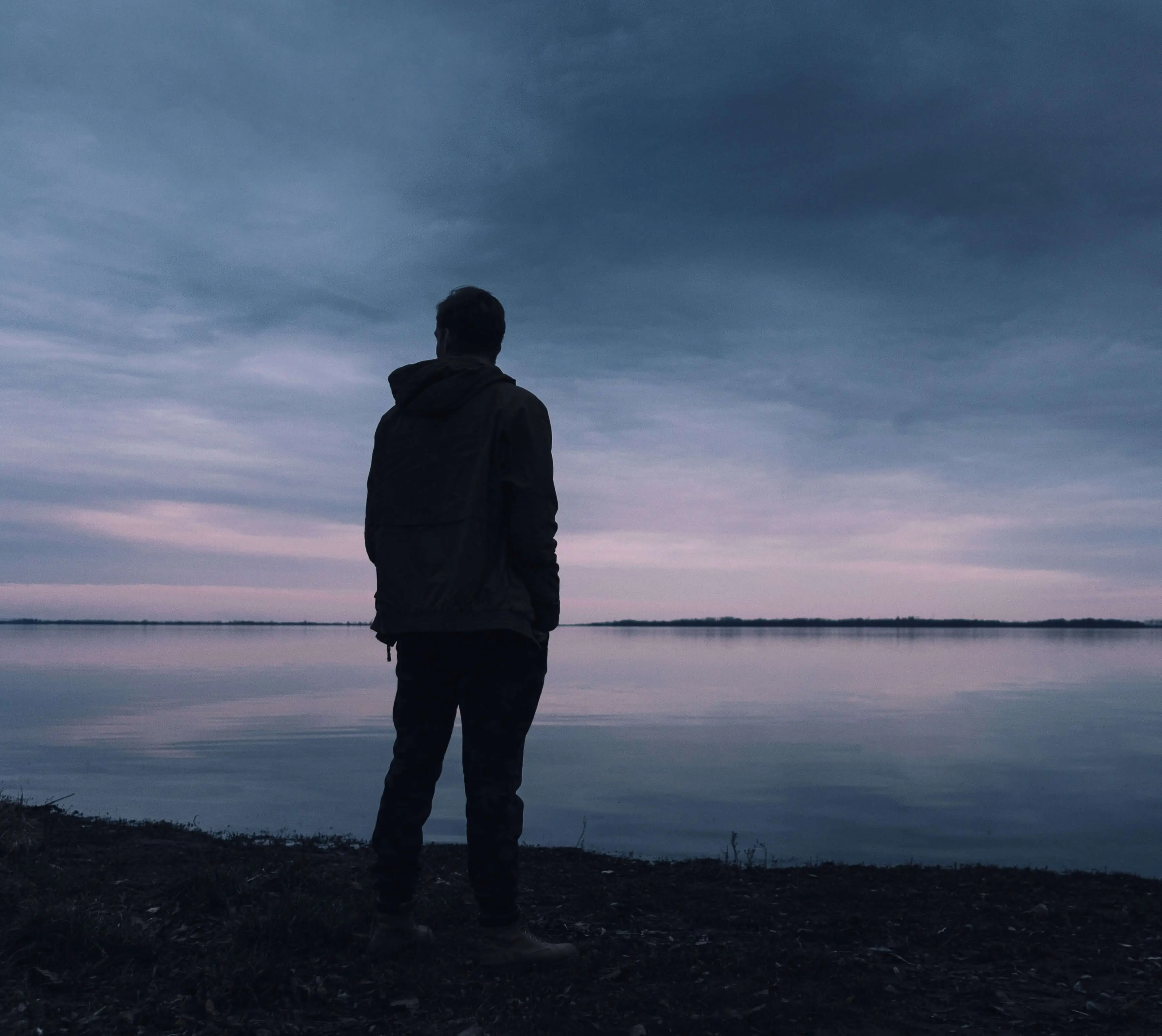 Image of man stood on beach