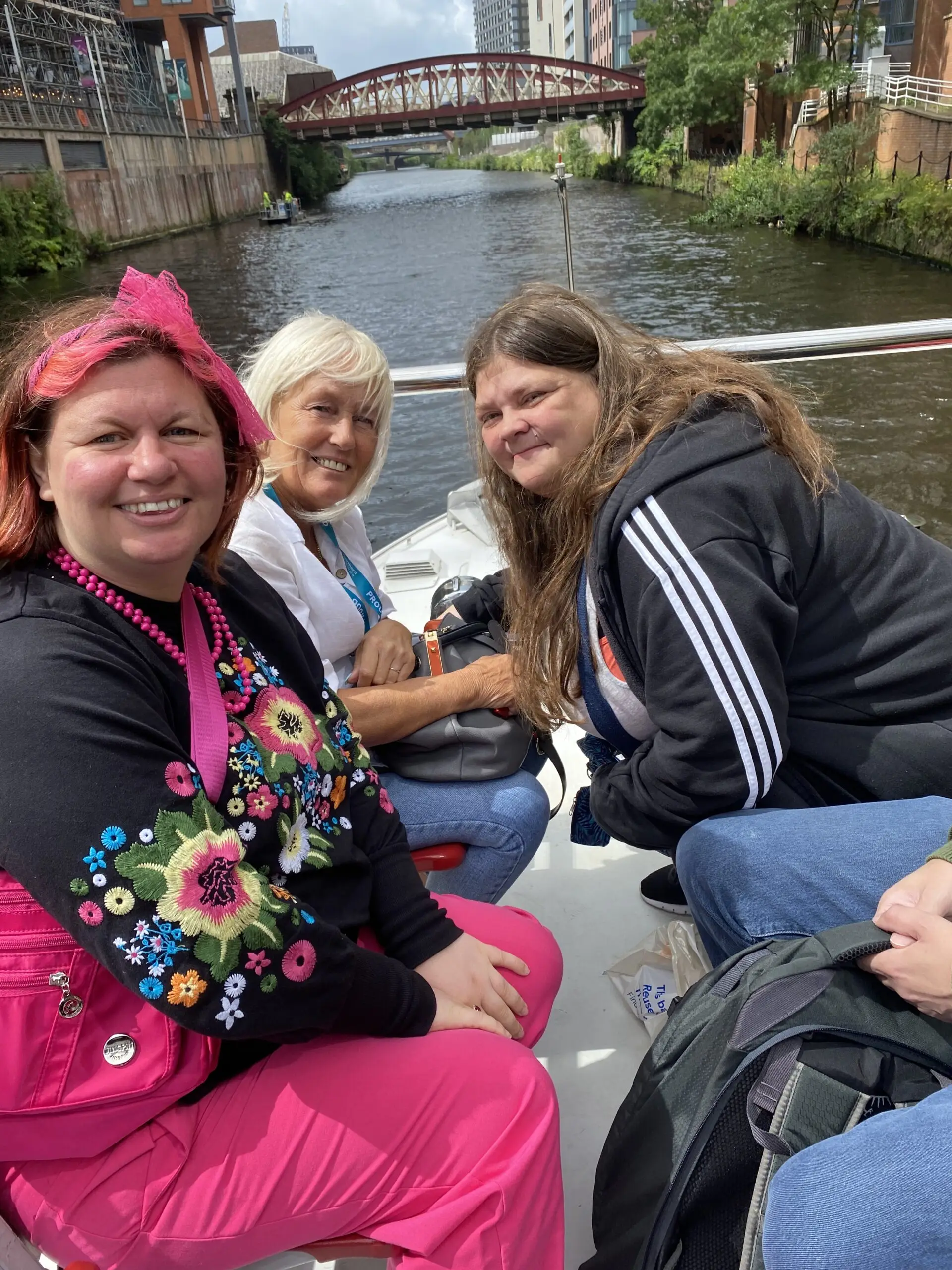 Residents and team members on a boat