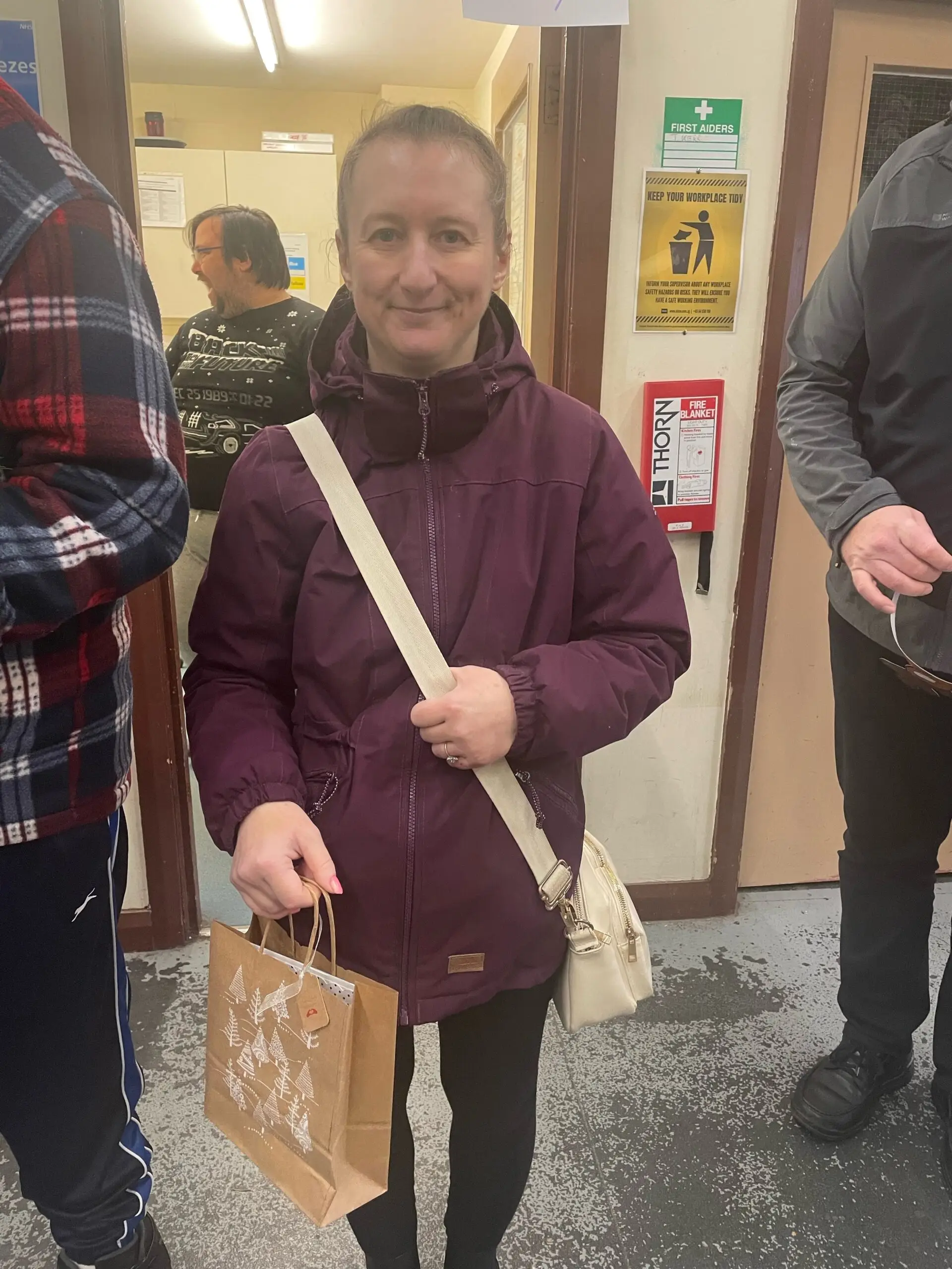 resident holding Christmas shopping bag