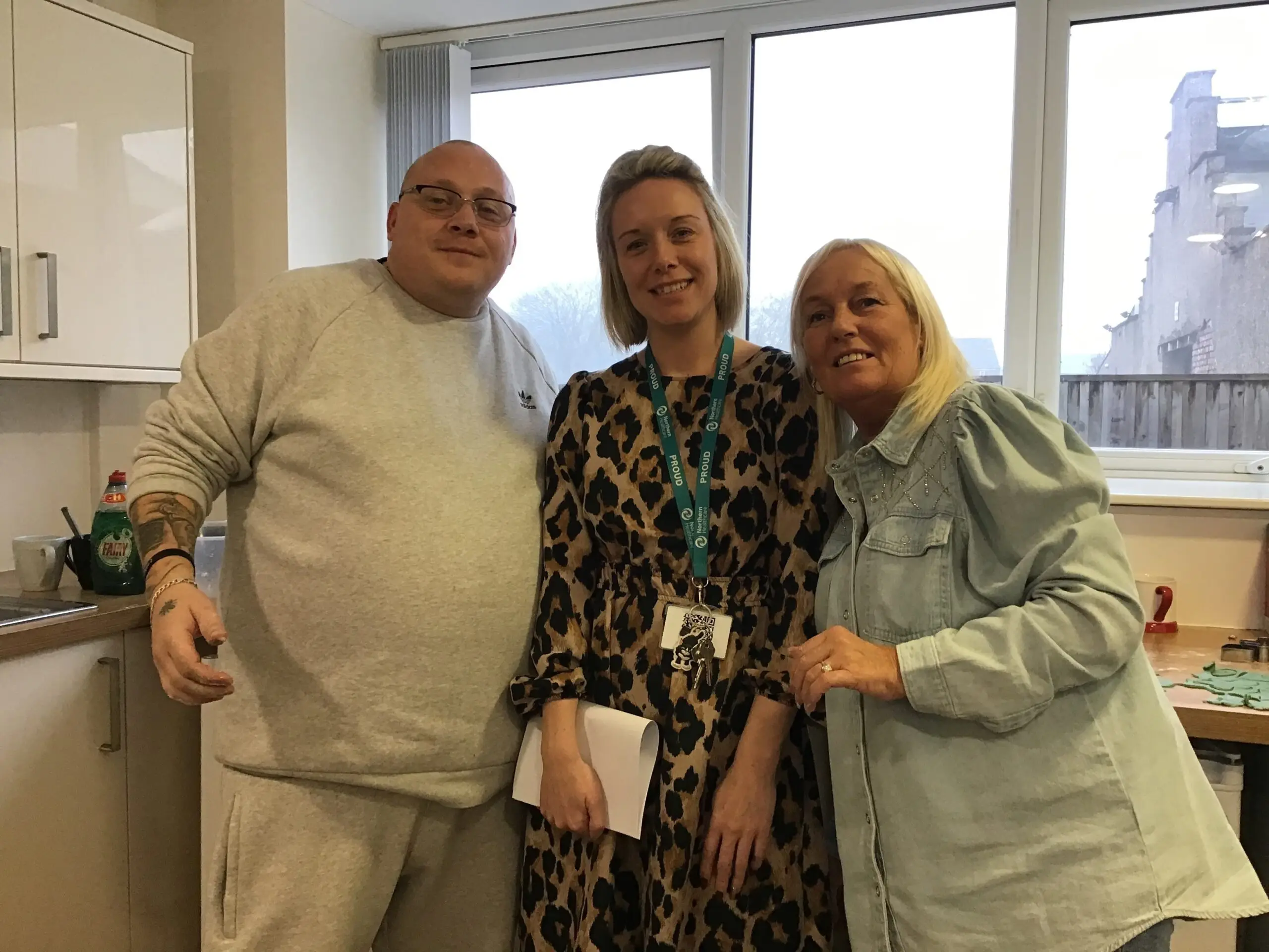 resident and team members in kitchen