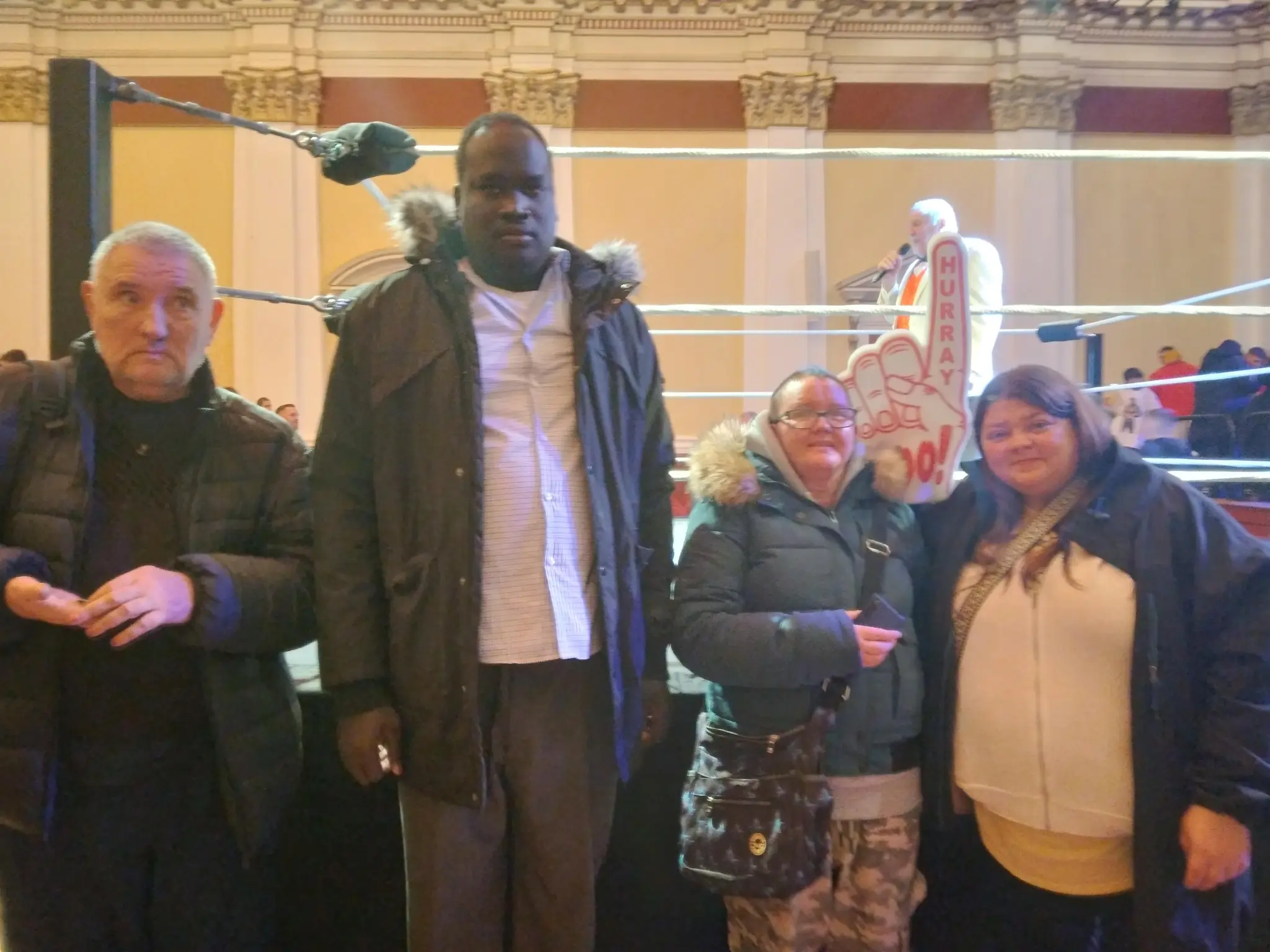 Residents posing with a wrestler