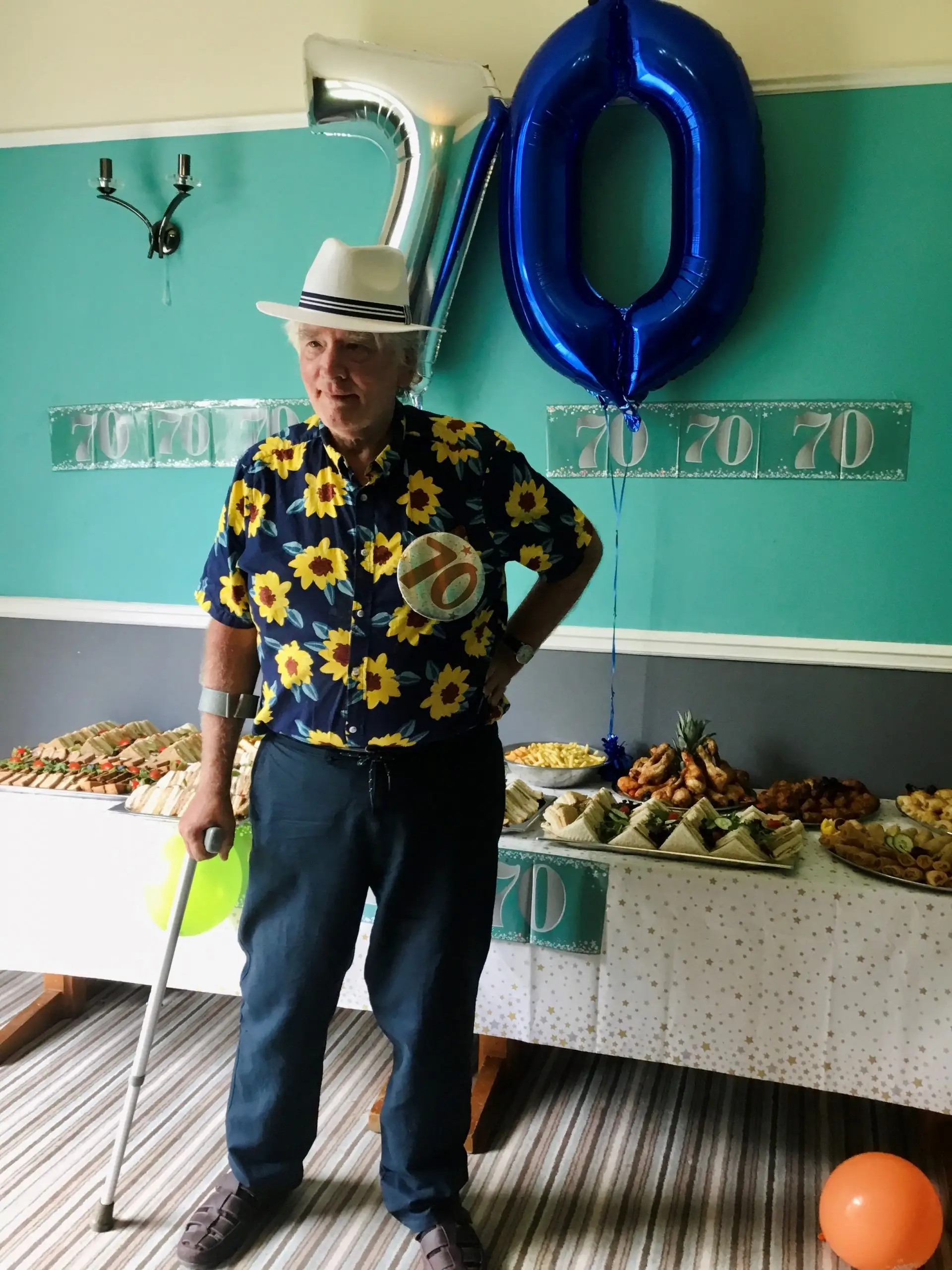 resident in front of 70th balloons