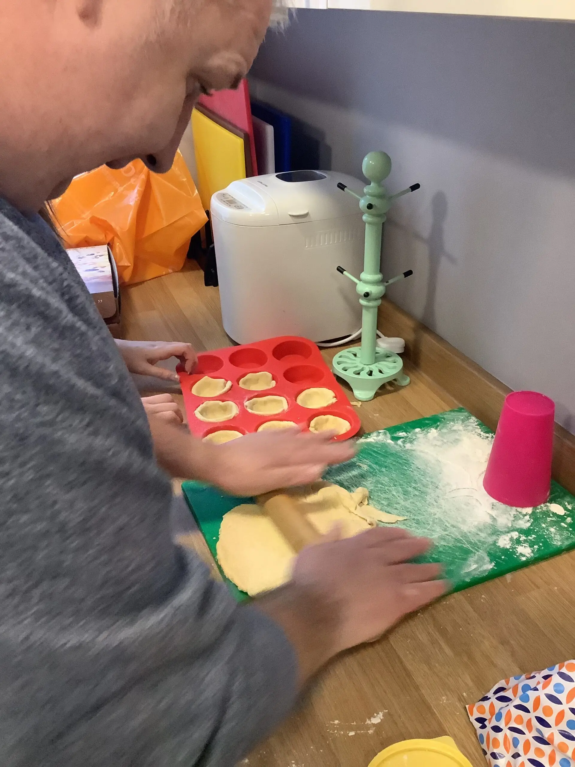 resident rolling out pastry