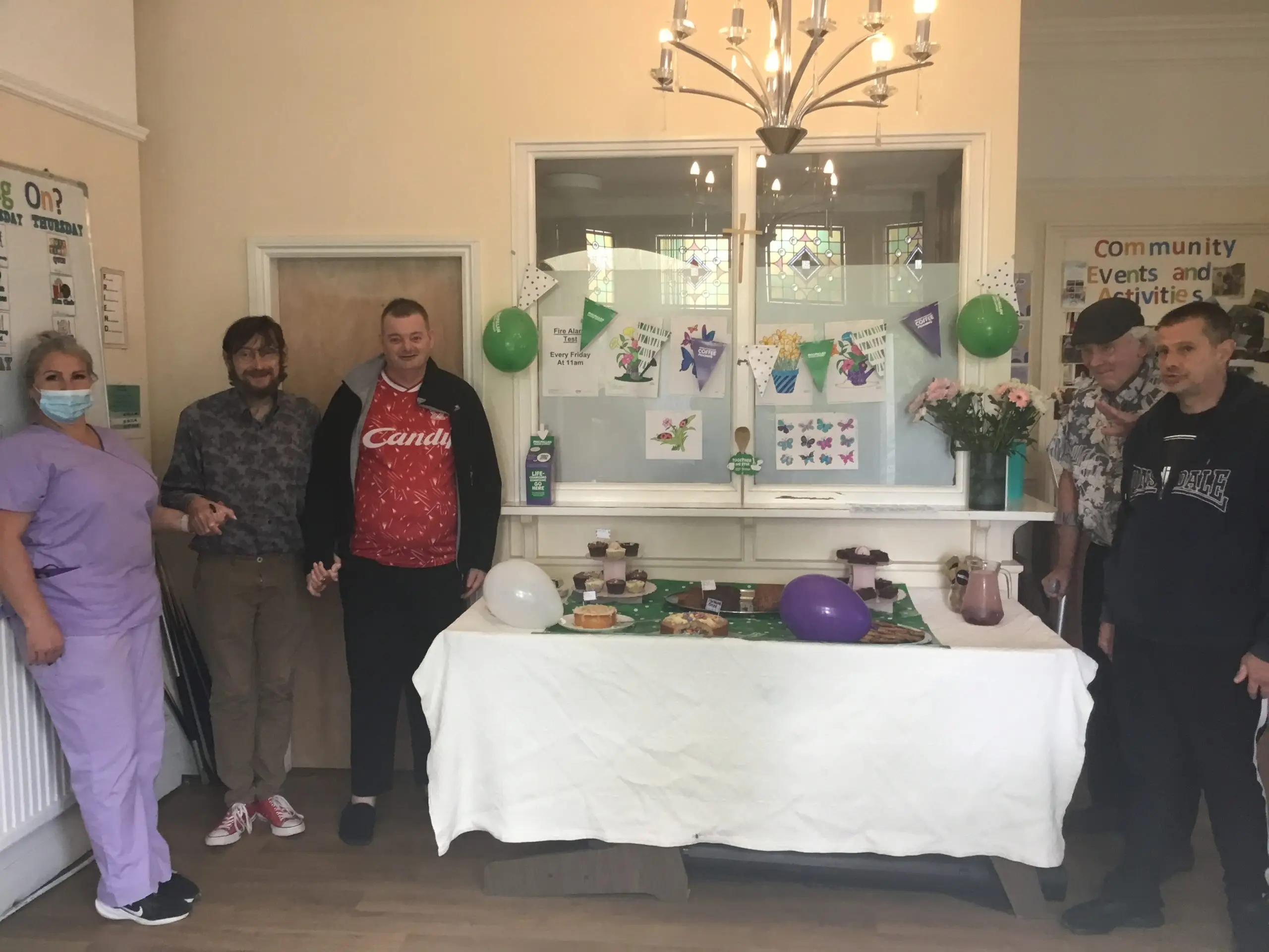 staff and residents at Macmillan coffee morning